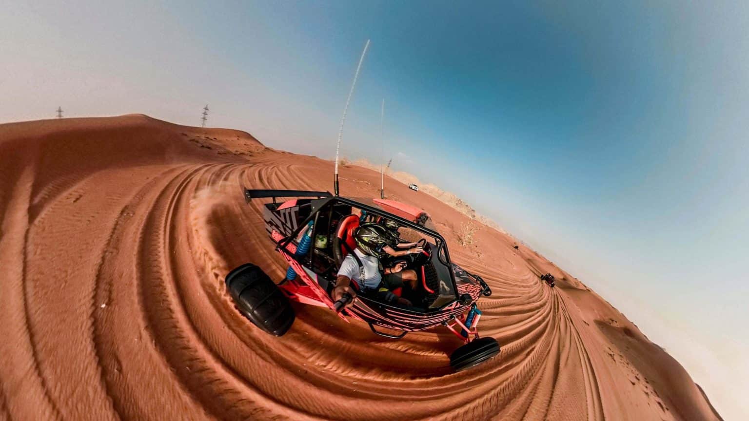 ourist driving a dune buggy during the best desert safari in Dubai