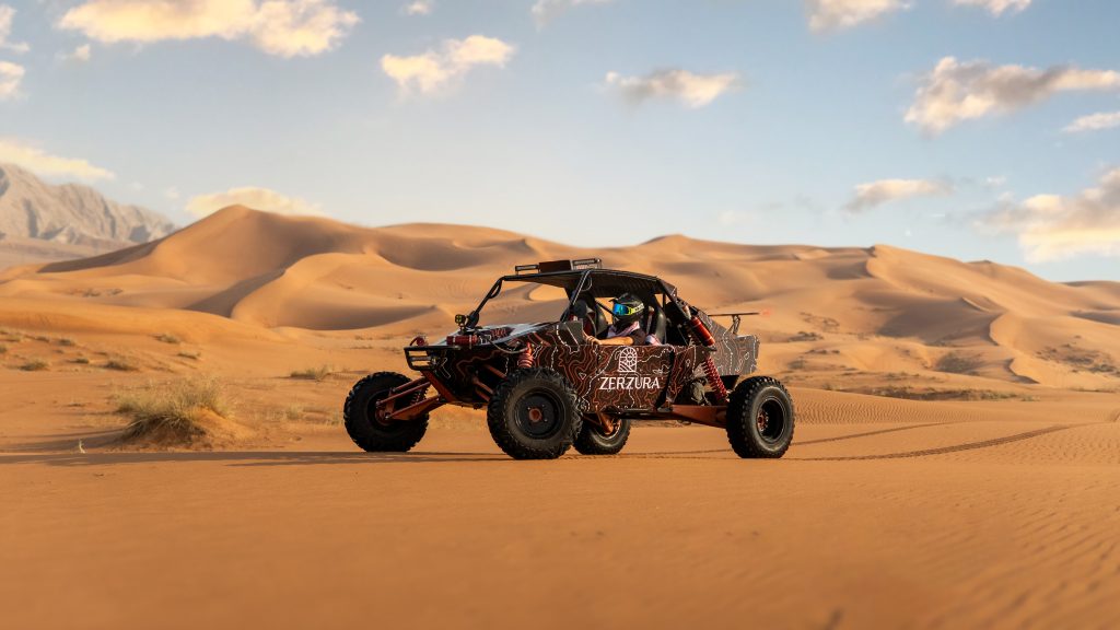 High-performance dune buggy parked on golden desert dunes during a luxury desert safari Dubai by Zerzura